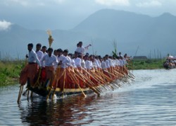 rowing boat with one leg in inle